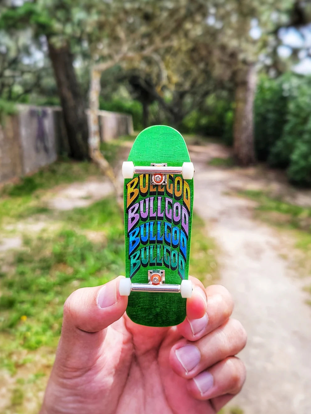 Green Bullgod fingerboard deck