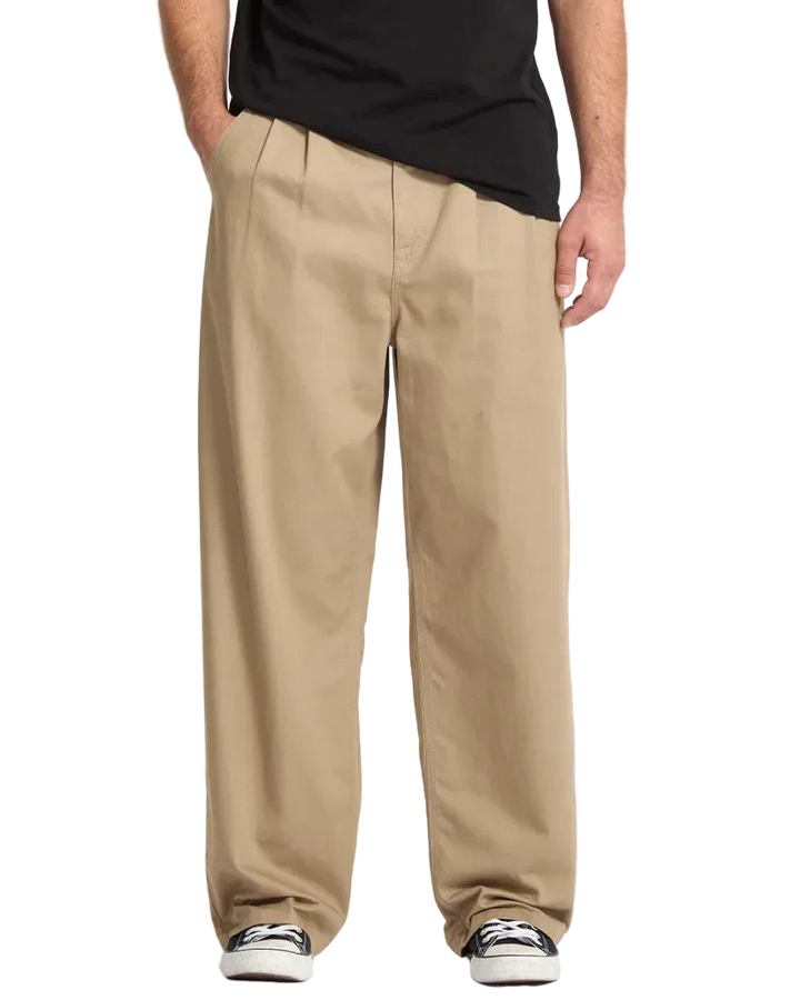 Person wearing beige pants  fit