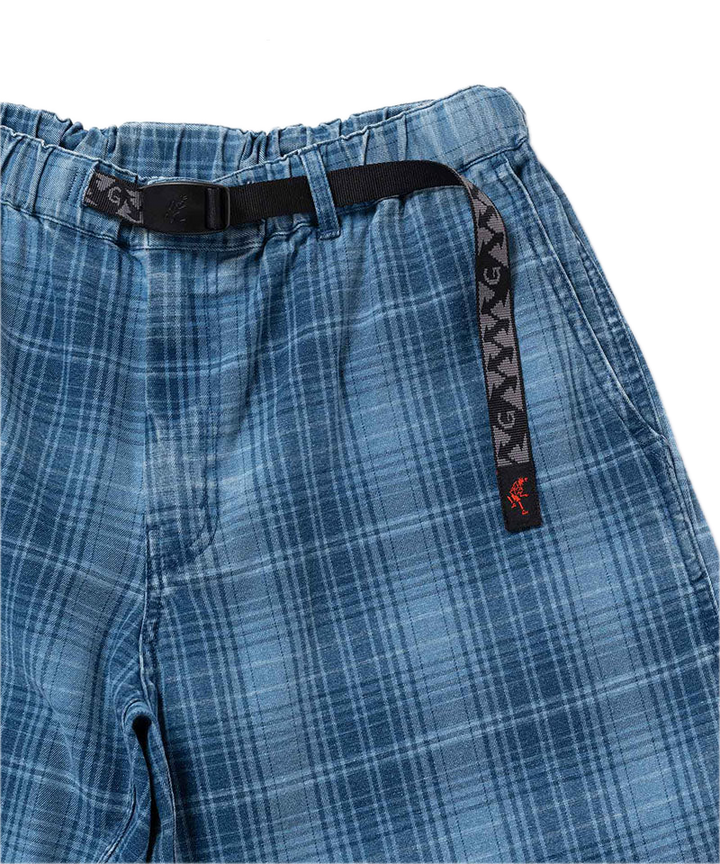 Blue plaid pants with a black belt and brand logo 