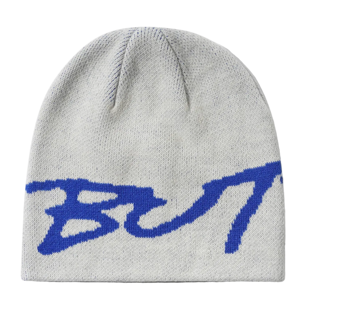 A light gray knit beanie with a large blue stylized  logo knitted across the front