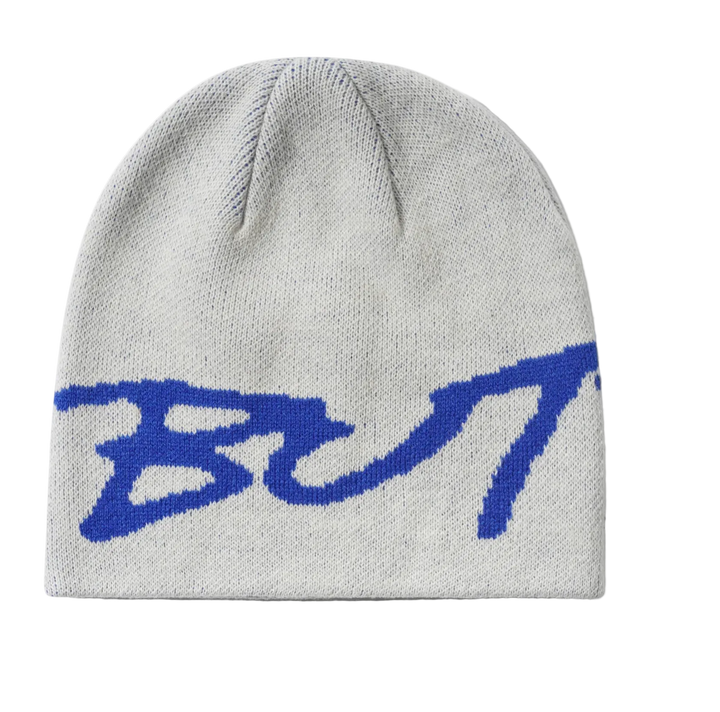 A light gray knit beanie with a large blue stylized  logo knitted across the front